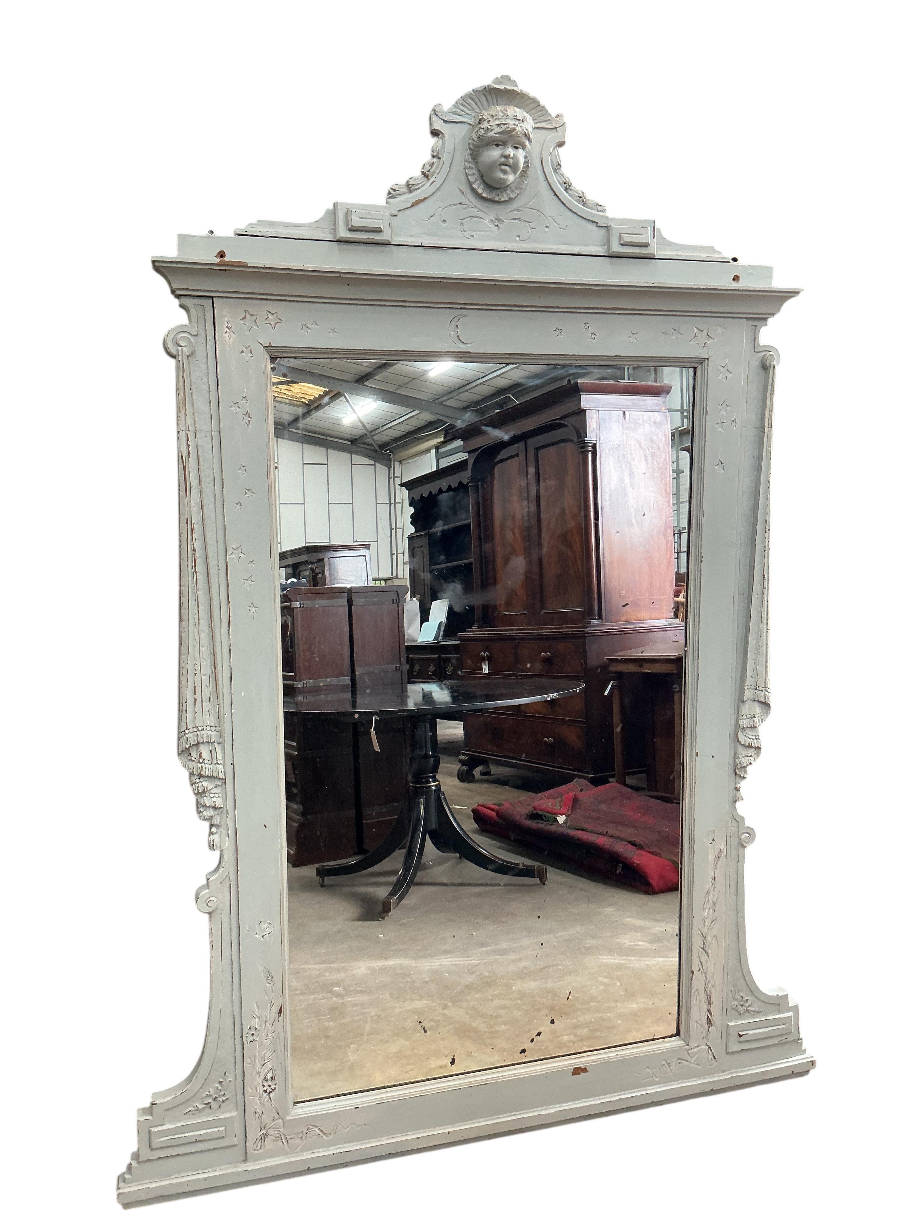 A 19th century Sicillian painted overmantel mirror, with cherub's head pediment, width 136cm, height 184cm
